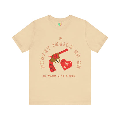 Unisex tshirt that uses the lyrics The Poetry Inside Of Me Is Warm Like A Gun by Lana Del Rey with a heart and gun unisex graphic tee